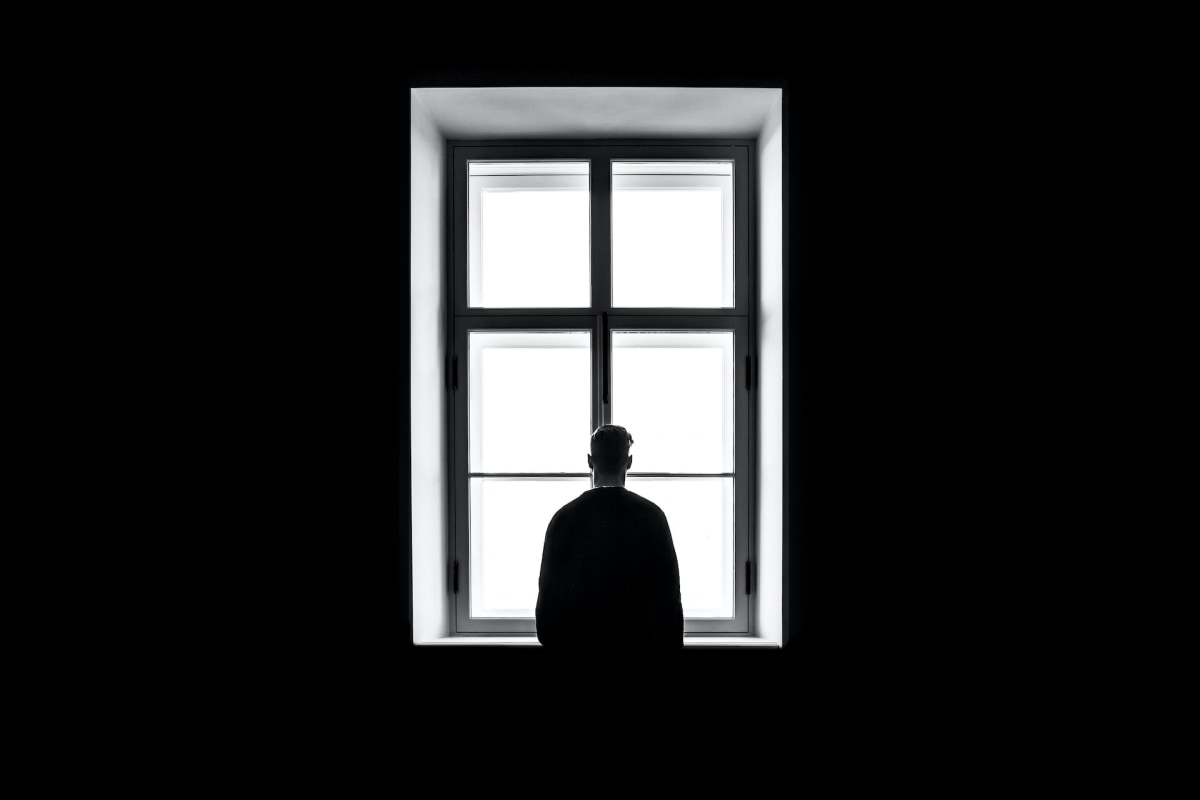 A person standing at the window